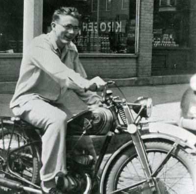 James Dean riding on motorcycle.
