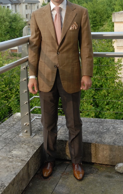 twobutton Man wearing a brown suit.